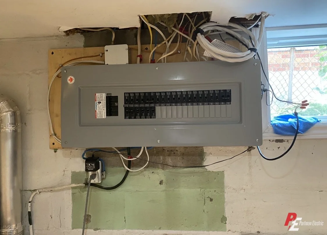 New electrical panel installed and wired in a Toronto basement by Portman Electric