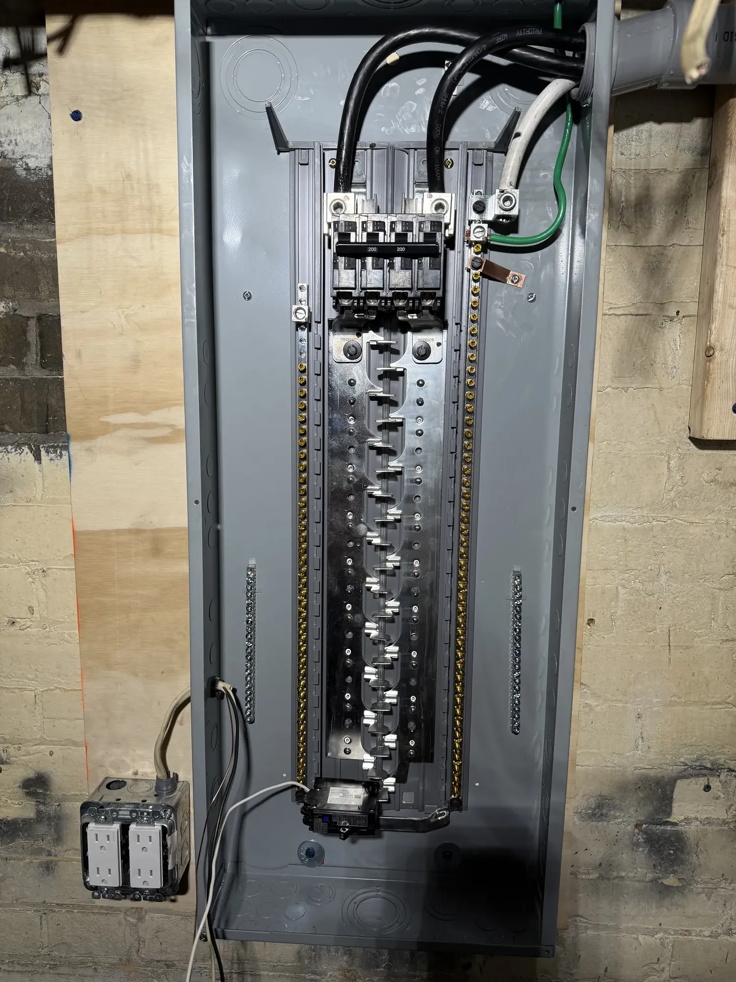 Completed 200 amp electrical service and breaker panel installed by Portman Electric in Toronto