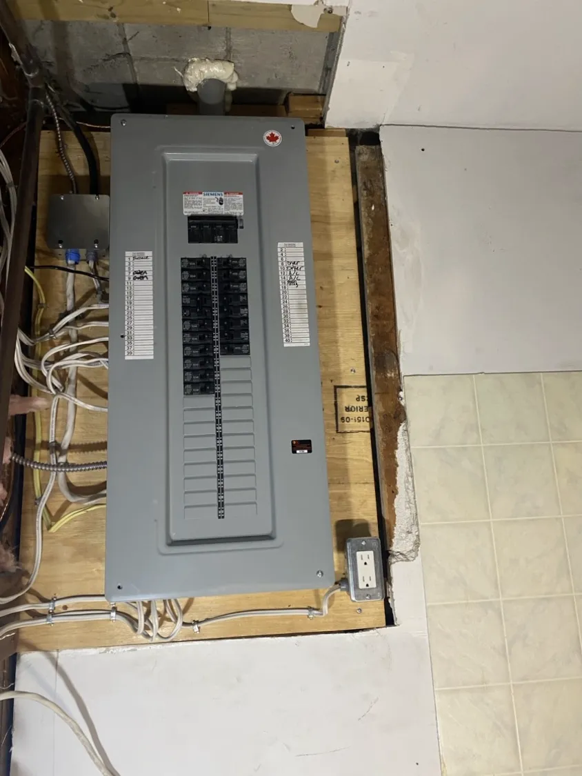 Completed Siemens breaker panel replacement with a full breaker lineup and handwritten circuit directory