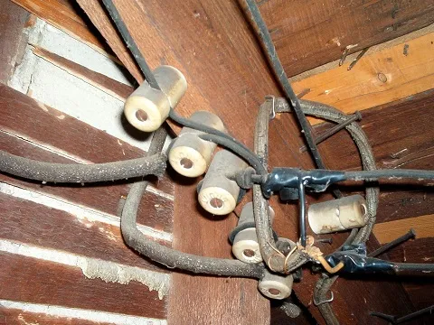 Knob-and-tube wiring inspected in the basement of an older Toronto home