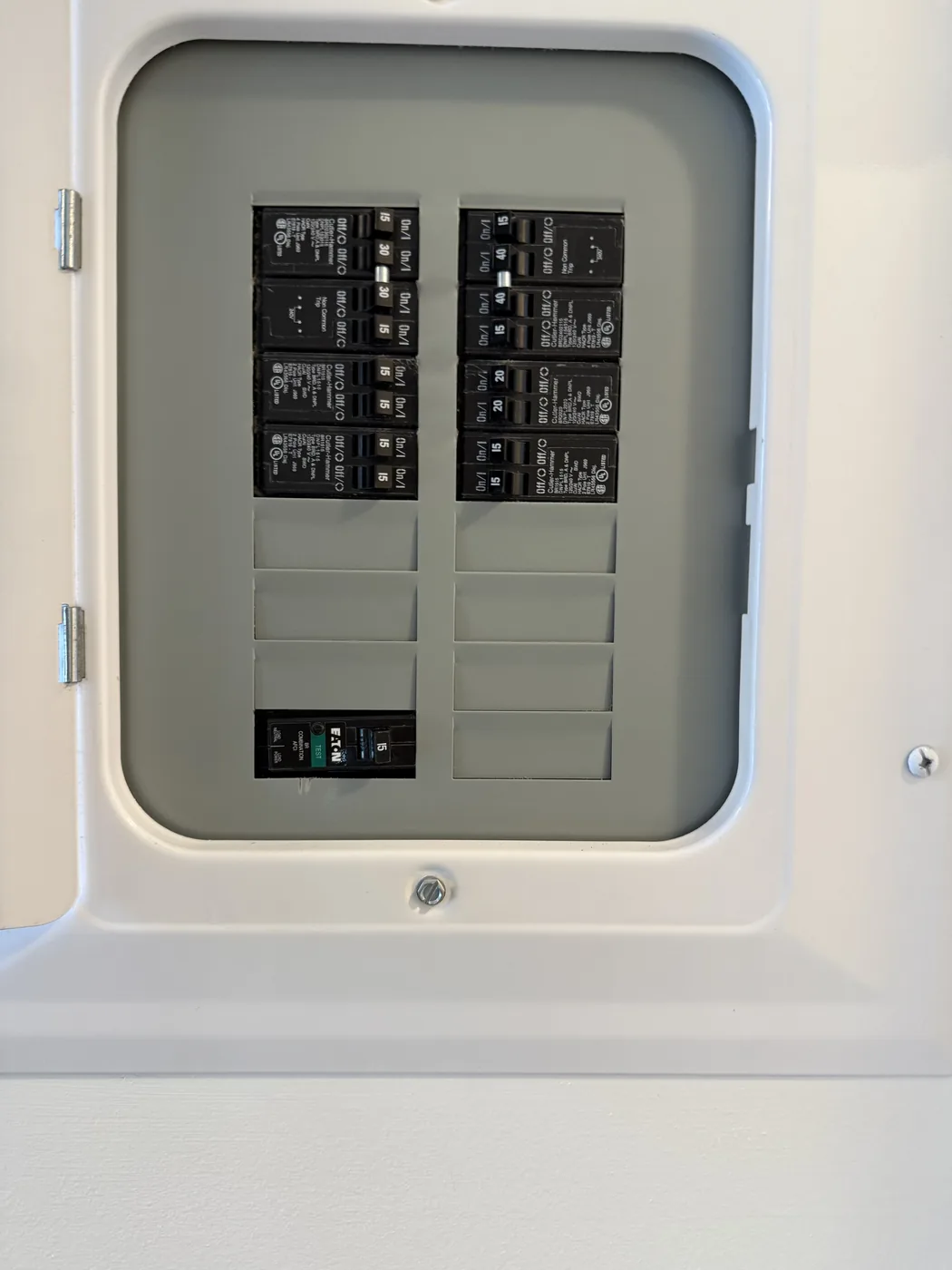 Finished modern breaker panel installation in a clean enclosure