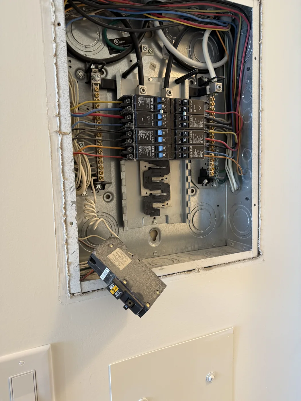 Interior of an old fuse box with original wiring
