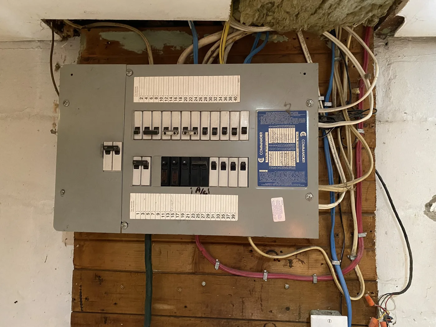 Original fuse panel board and old wiring in an older home