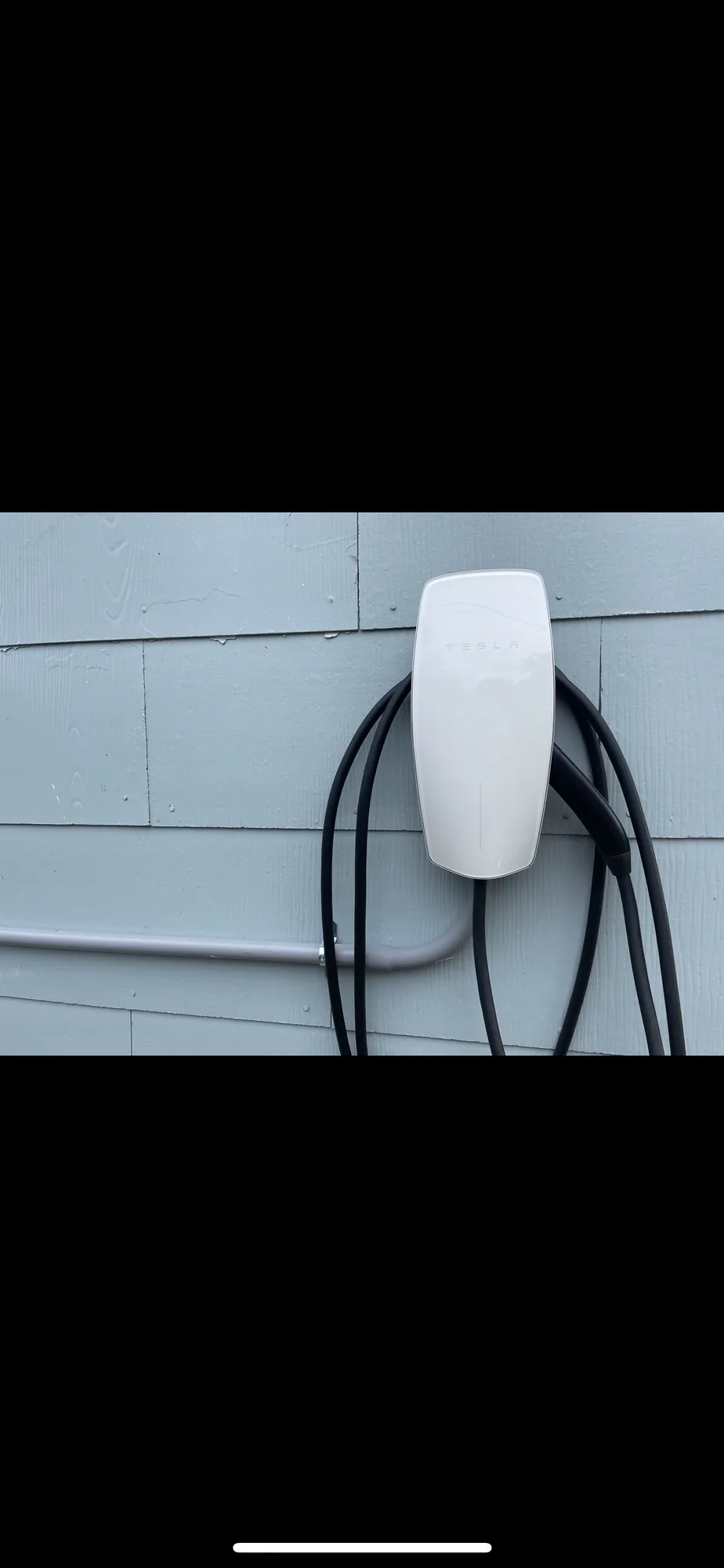 EV charger installed on a residential wall by Portman Electric in Toronto.