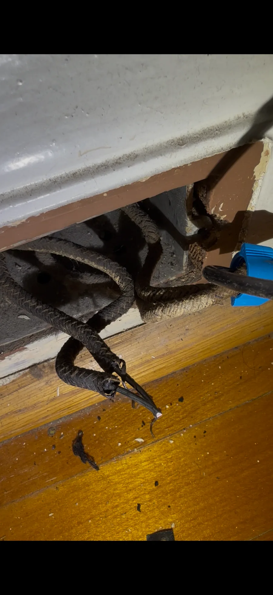 Old wiring with deteriorating cloth insulation in an older Toronto basement before rewiring