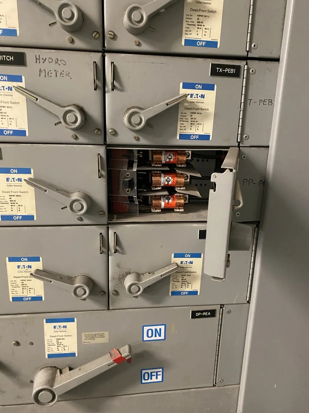 Commercial electrical switchboard inspected after a parking garage lighting short circuit in Toronto.