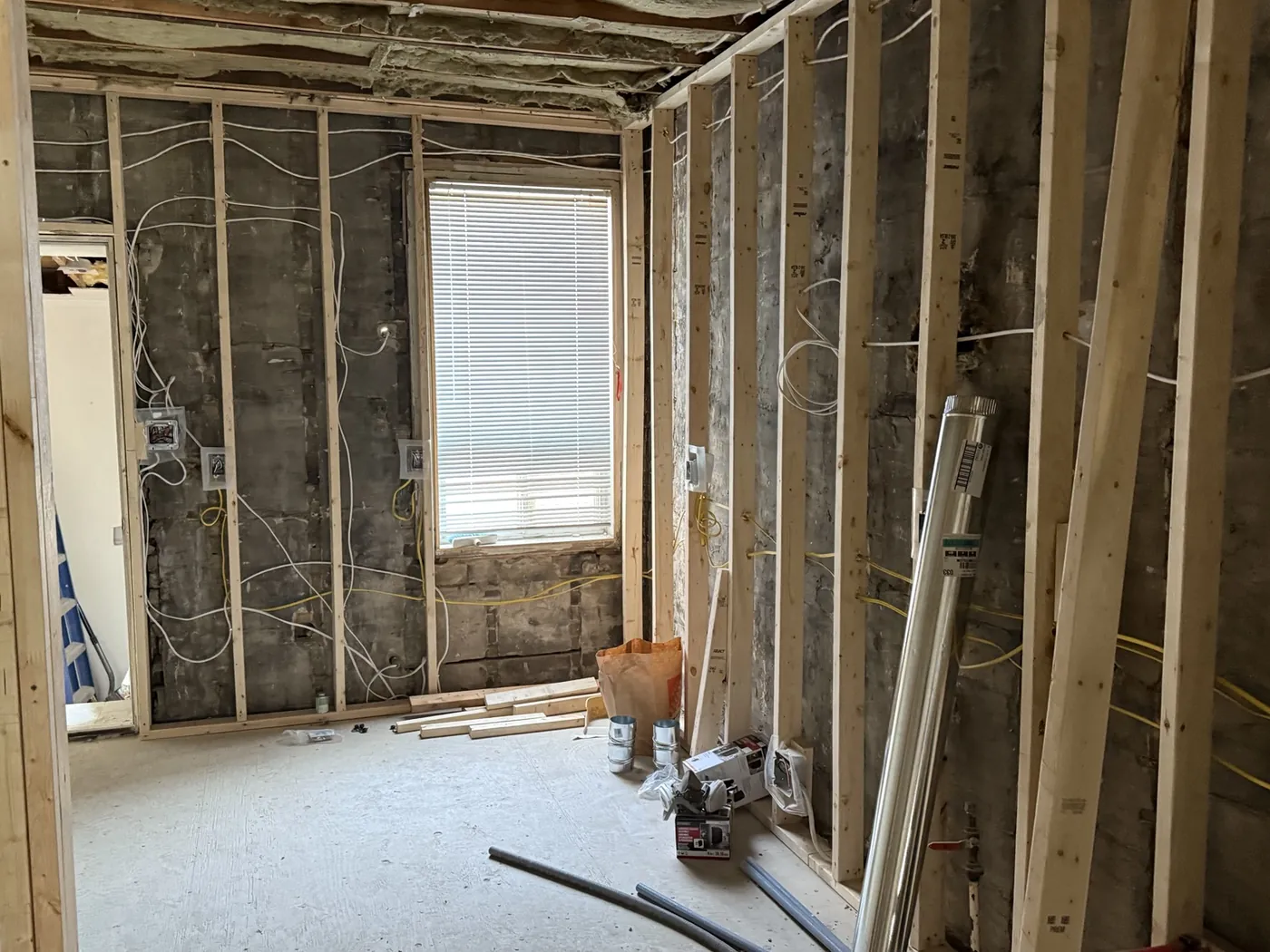 New electrical wiring and boxes coordinated with rebuilt framing during a Toronto home rewire.