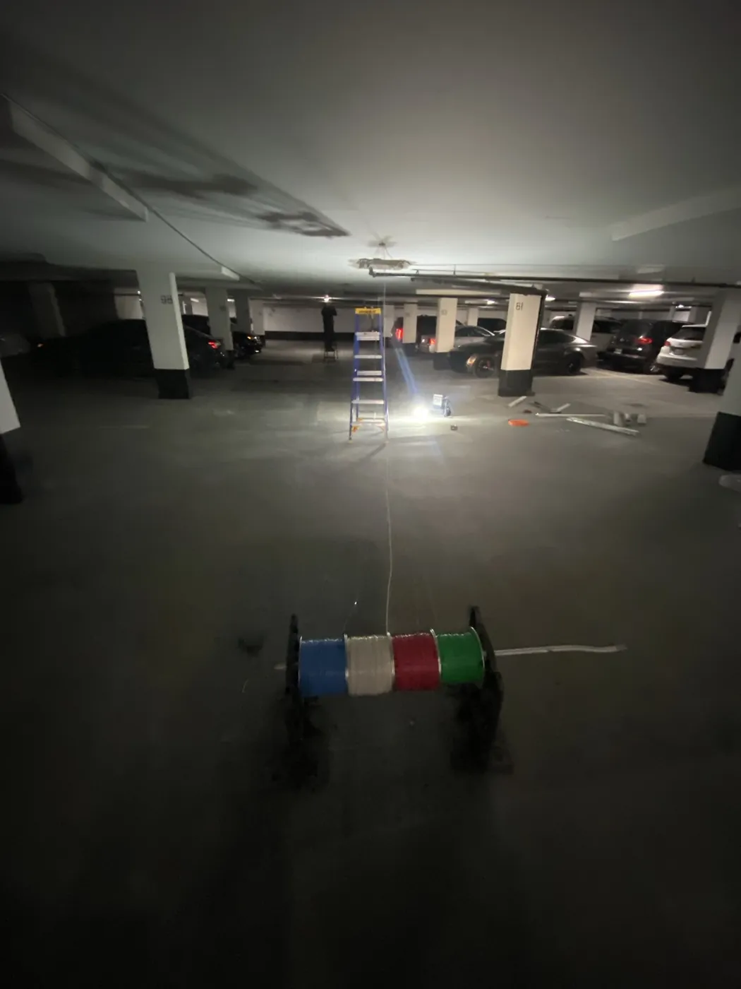 Overnight electrical repair work restoring lighting in a Toronto parking garage.