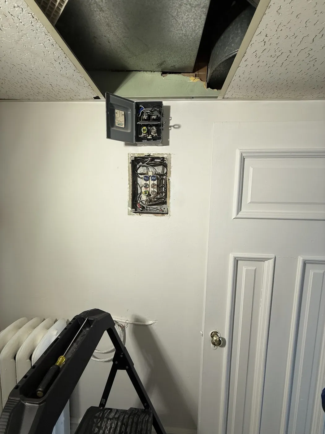 Existing fuse panels opened during an electrical investigation in St. Clair West Toronto.